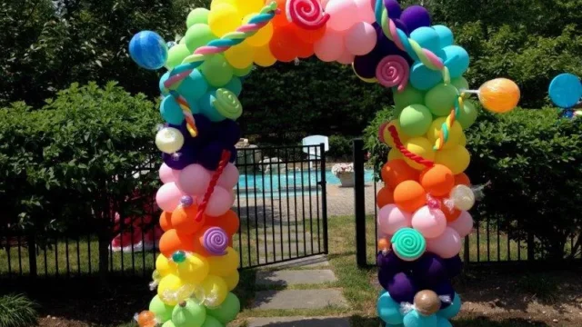 candy themed outdoor balloon arch