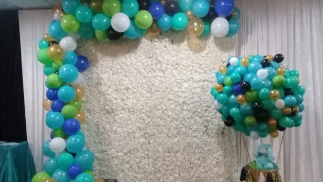 multi colored balloon garland with a bear in a hot air balloon