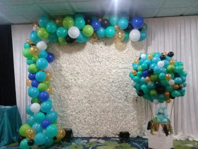 multi colored balloon garland with a bear in a hot air balloon