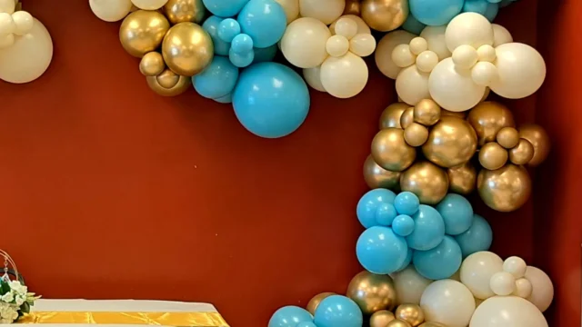 blue, white, and gold organic balloon garland