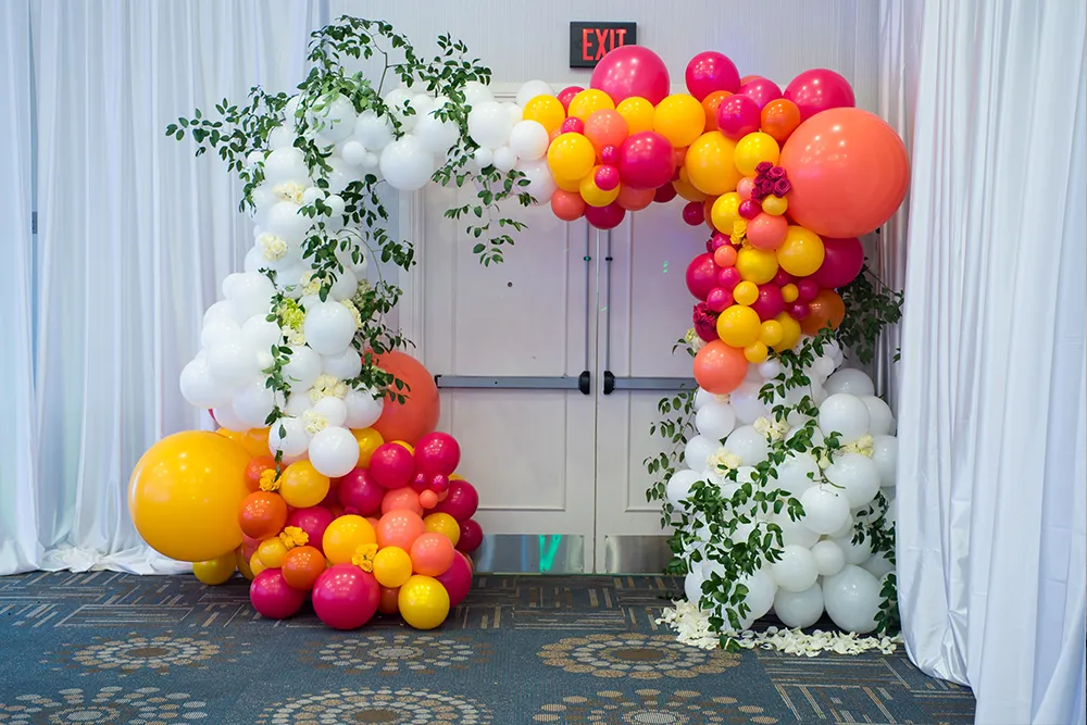 indoor organic balloon arch with flowers