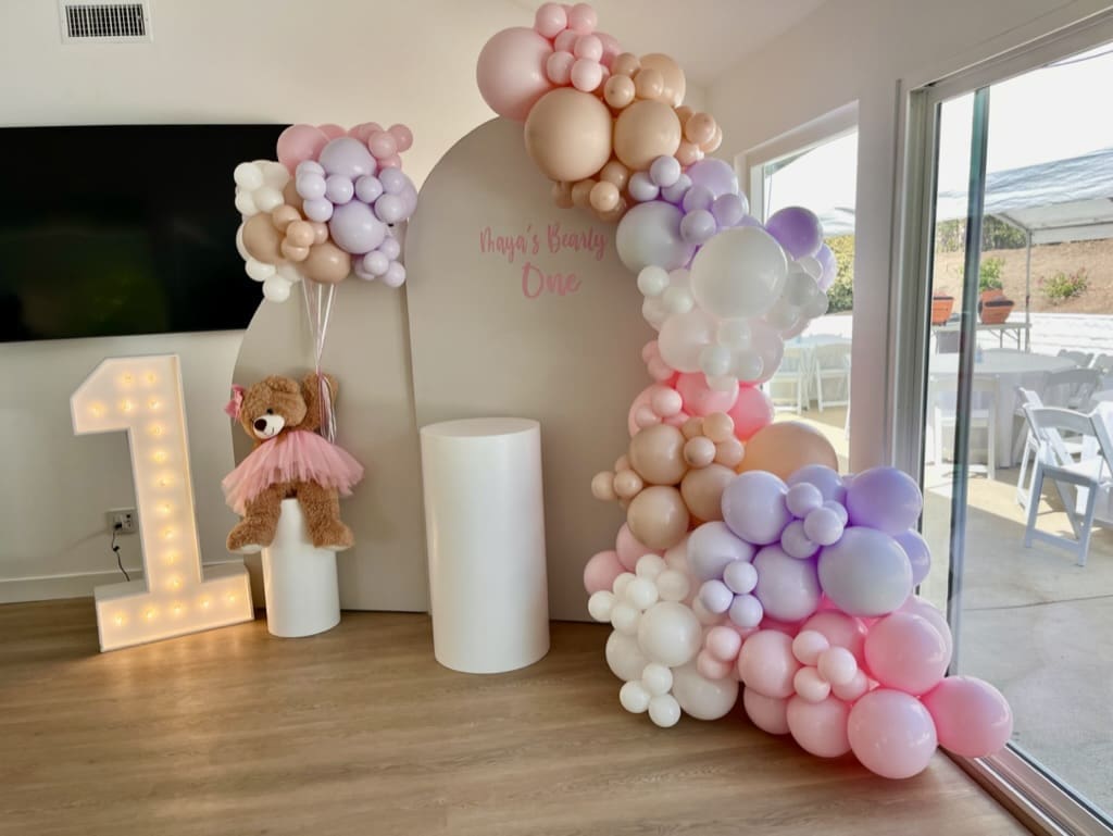first birthday chiara wall arch backdrop with teddy bear