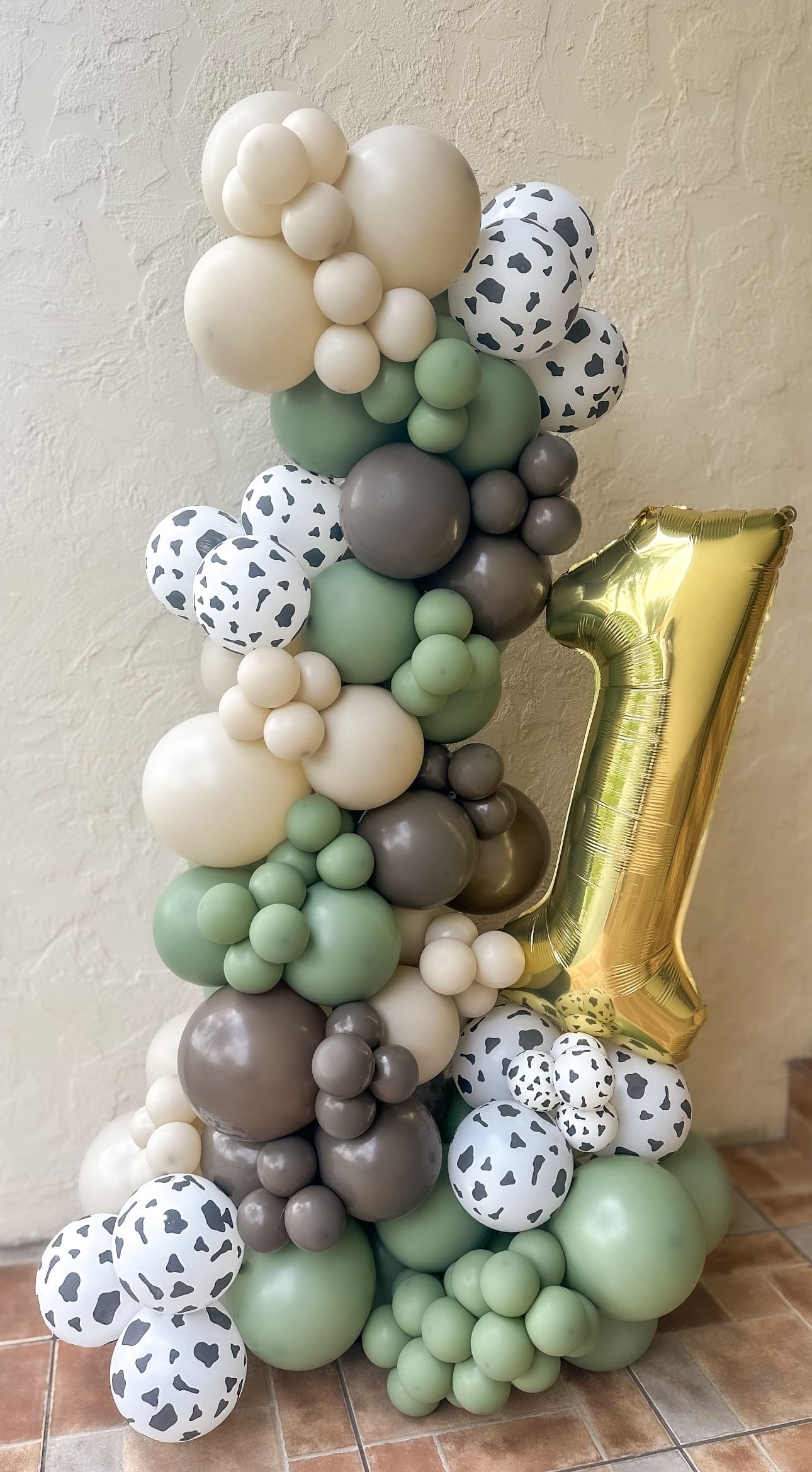 large organic balloon sculpture for 1st birthday