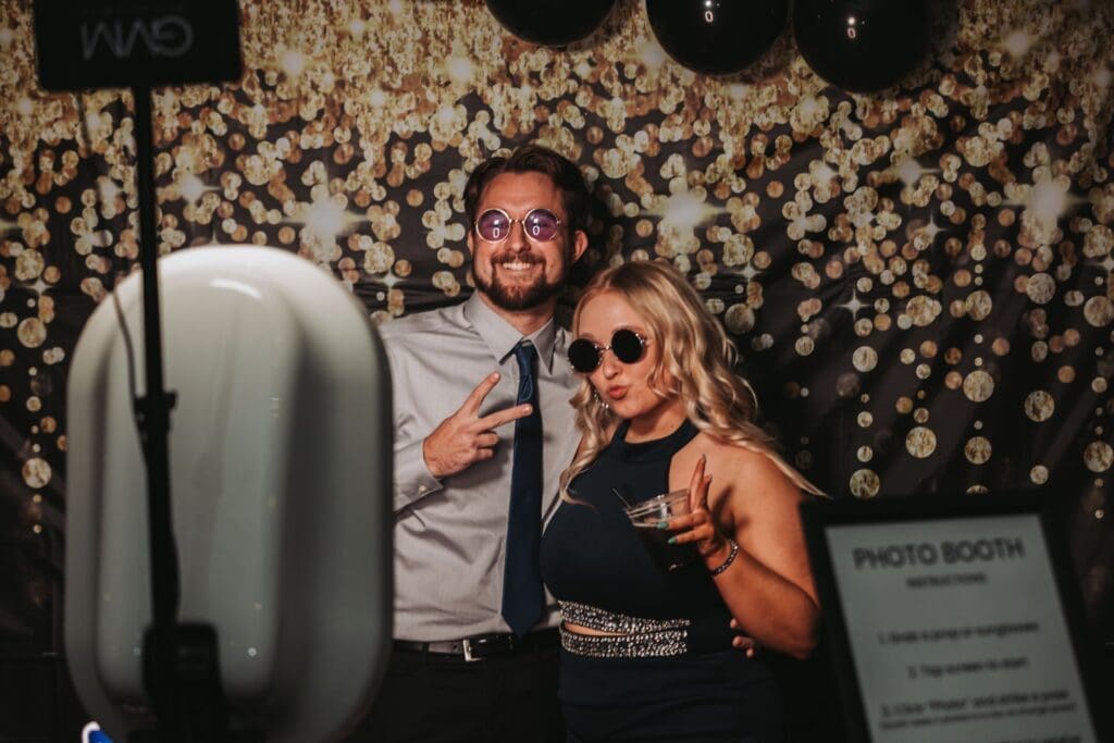 Photobooth where a guy and girl are getting photographed