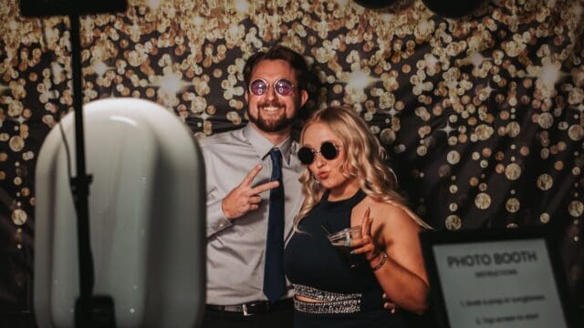 Photobooth where a guy and girl are getting photographed