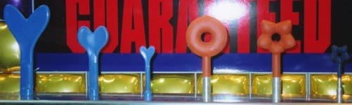 Pioneer Balloon Company display of balloon molds for Qualatex hearts, donuts, and blossom geos.